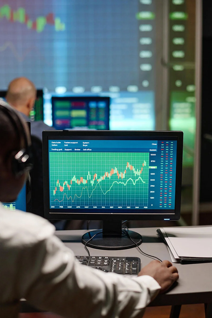 Energy trading professional working with market data and financial charts